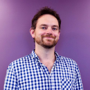 A portrait of Max on a purple background